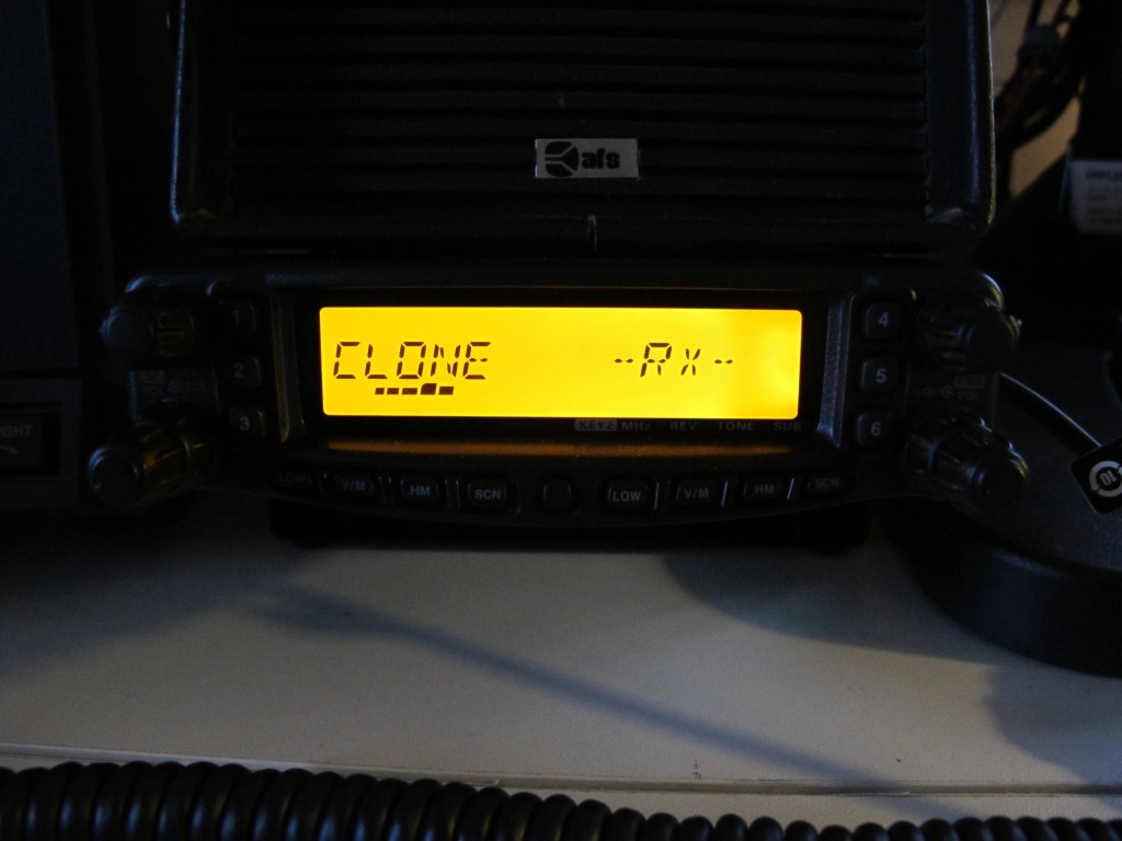 Radio in RX mode with bar showing uploading to radio progress